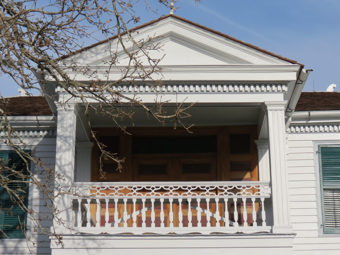 The McGregor-Grimm House features a pediment porch. The main doors as well as these doors leading to the porch are painted to replicate different kinds of wood.