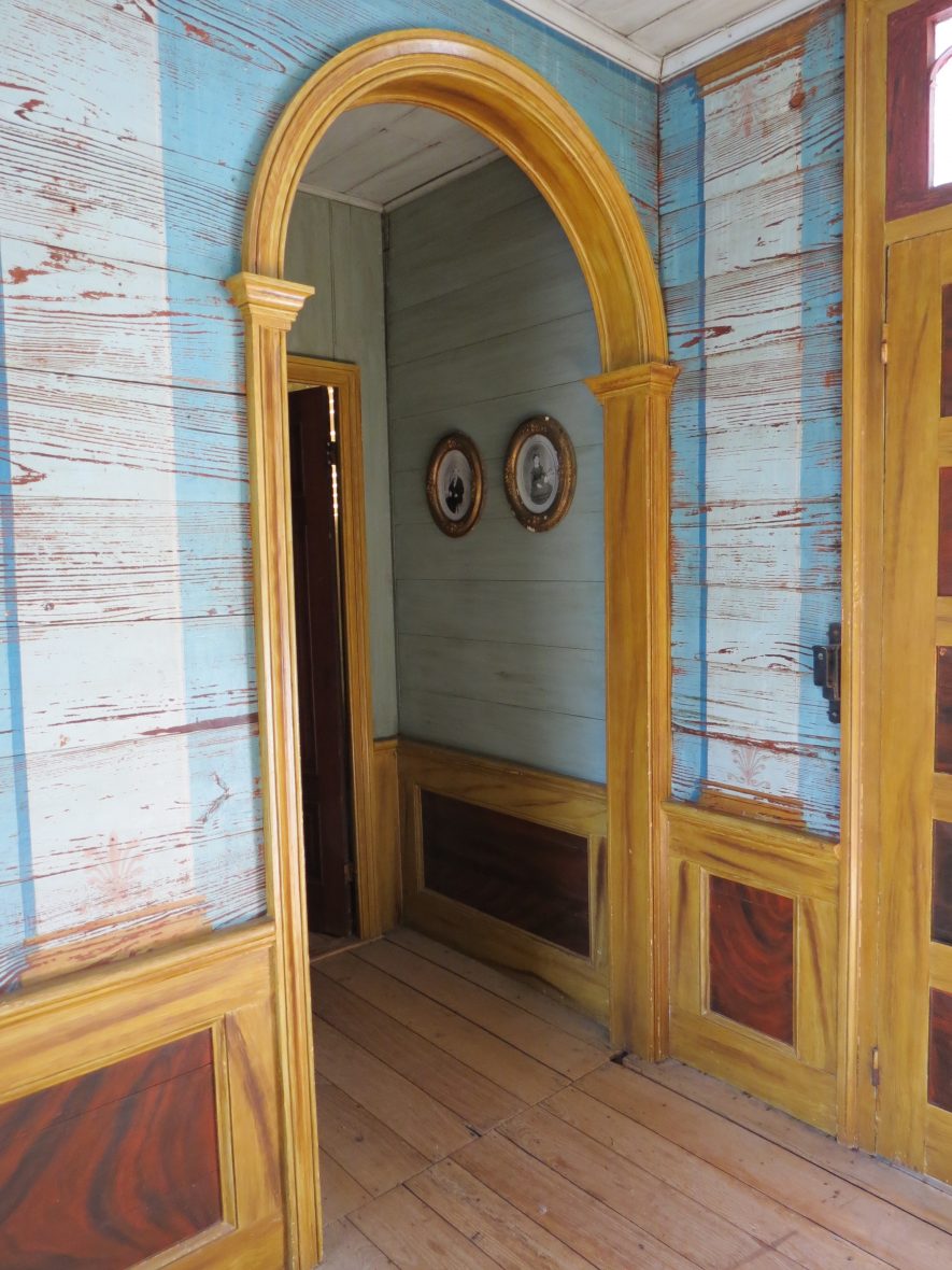 The entrance hall at the McGregor-Grimm House features columns painted on the walls.