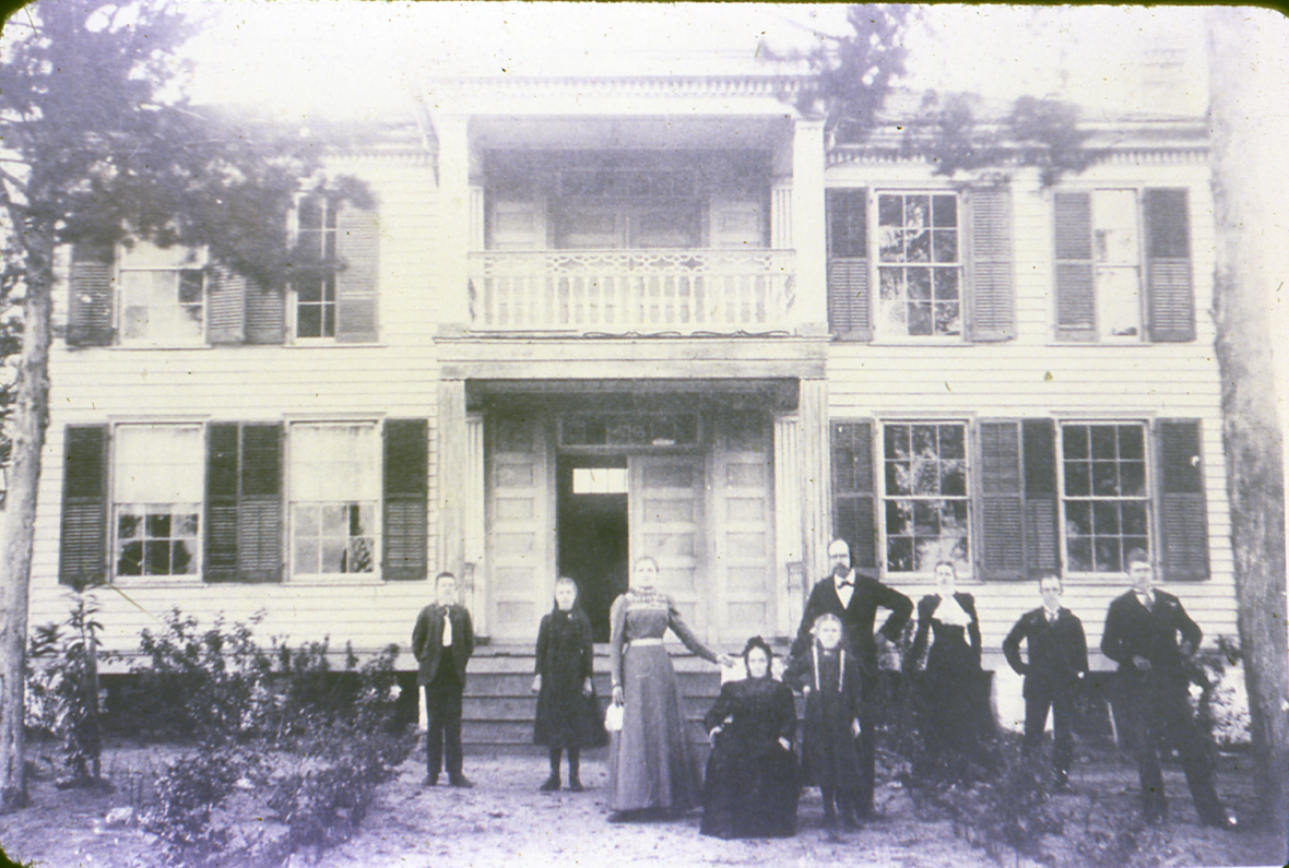 The Schloeman family, ca. 1880s. Mary Schloeman, who purchased the house from Dr. McGregor, is sitting in the chair.
