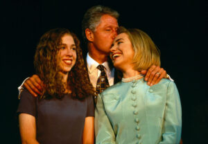 President Bill Clinton embraces wife Hillary and daughter Chelsea at the 1996 Democratic convention.